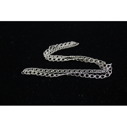 208 - A collection of silver chain necklaces including curb link (87g)