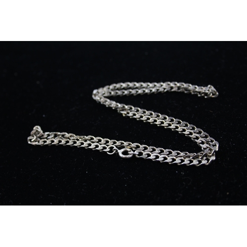 208 - A collection of silver chain necklaces including curb link (87g)