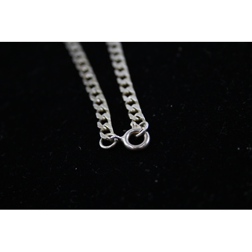 208 - A collection of silver chain necklaces including curb link (87g)