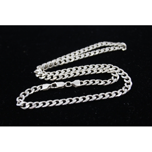 208 - A collection of silver chain necklaces including curb link (87g)