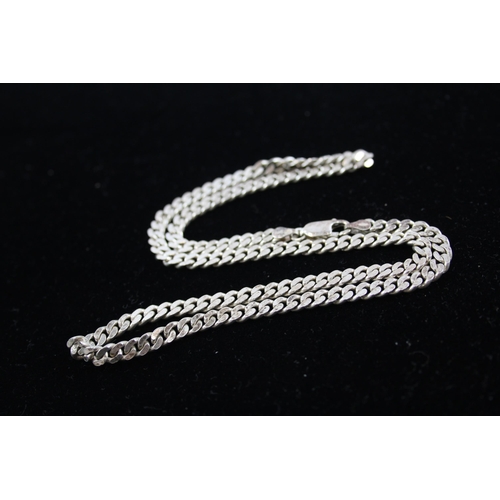 208 - A collection of silver chain necklaces including curb link (87g)