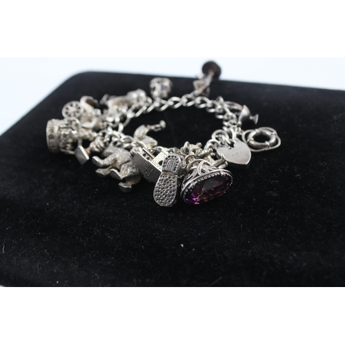 211 - Silver charm bracelet including 1977 Queen charm (86g)