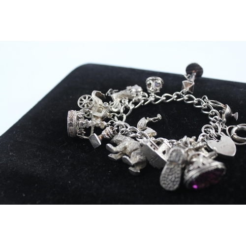 211 - Silver charm bracelet including 1977 Queen charm (86g)