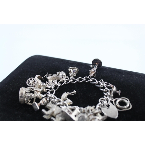 211 - Silver charm bracelet including 1977 Queen charm (86g)