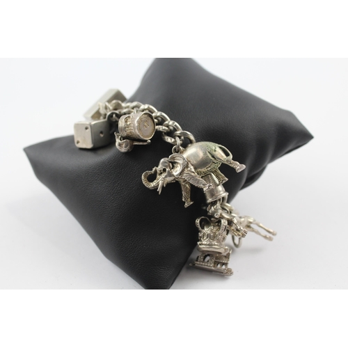 213 - Silver charm bracelet including animal charms (107g)