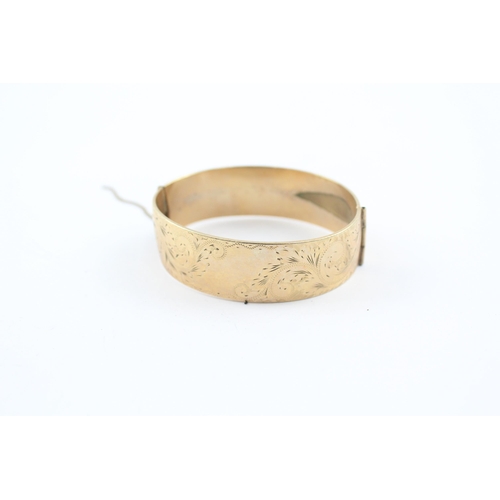 230 - 9ct rolled gold bangle with etched design (52g)