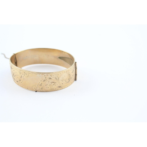 230 - 9ct rolled gold bangle with etched design (52g)