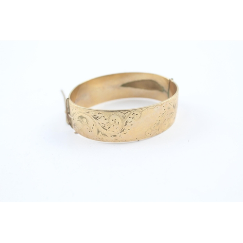 230 - 9ct rolled gold bangle with etched design (52g)