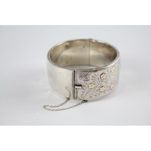 239 - Two silver antique bangles including gold detailing (114g)