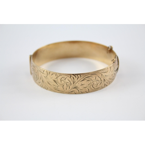 240 - 9ct rolled gold bangle with etched design (41g)