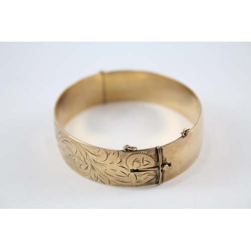 240 - 9ct rolled gold bangle with etched design (41g)