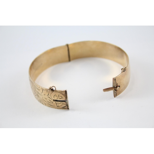 240 - 9ct rolled gold bangle with etched design (41g)