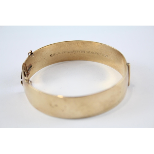 240 - 9ct rolled gold bangle with etched design (41g)