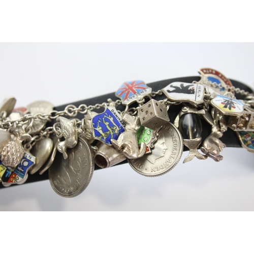 243 - Silver charm bracelet including souvenir charms (78g)