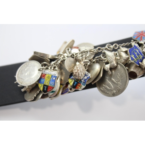 243 - Silver charm bracelet including souvenir charms (78g)