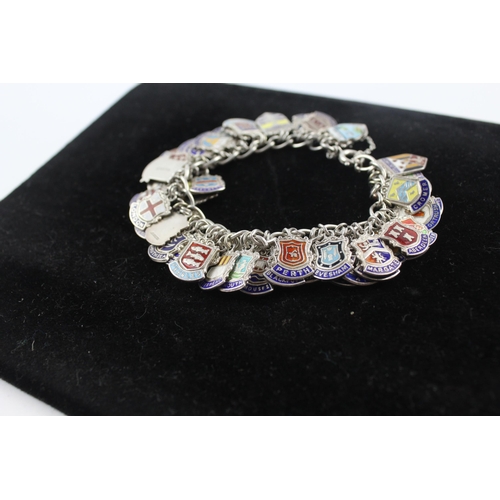 263 - Silver charm bracelet with enamel souvenir charms (91g)