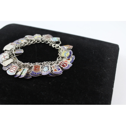 263 - Silver charm bracelet with enamel souvenir charms (91g)