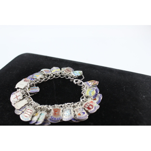 263 - Silver charm bracelet with enamel souvenir charms (91g)