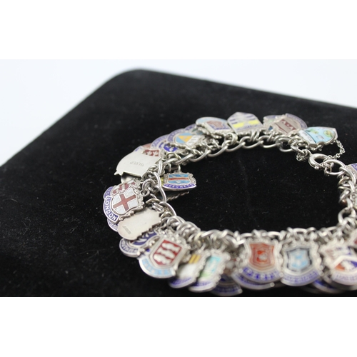 263 - Silver charm bracelet with enamel souvenir charms (91g)