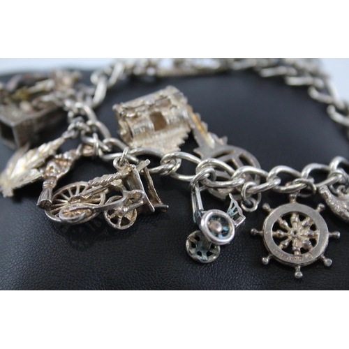 274 - Silver charm bracelet including 21 key charm (65g)