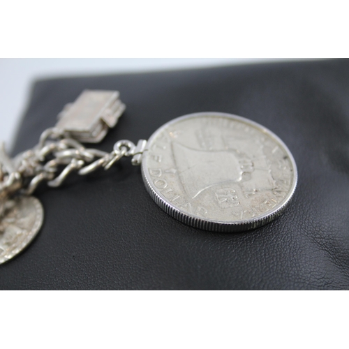 281 - Silver charm bracelet including half dollar coin (74g)