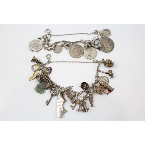 288 - Two silver charm bracelets including religious charms (87g)