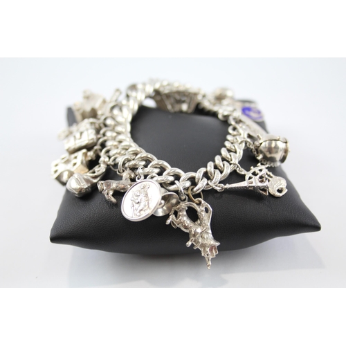 294 - Silver charm bracelet including Scottish charms (114g)