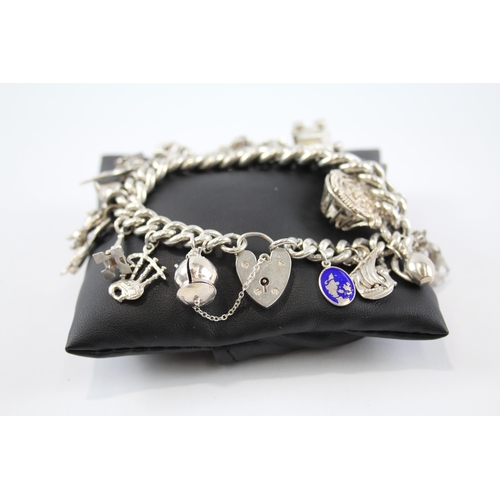 294 - Silver charm bracelet including Scottish charms (114g)