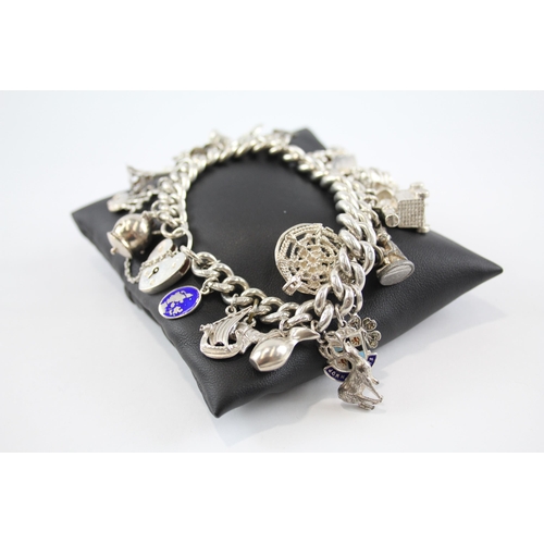 294 - Silver charm bracelet including Scottish charms (114g)