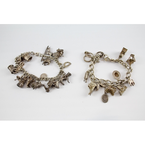 296 - Two silver charm bracelets including animal charms (87g)