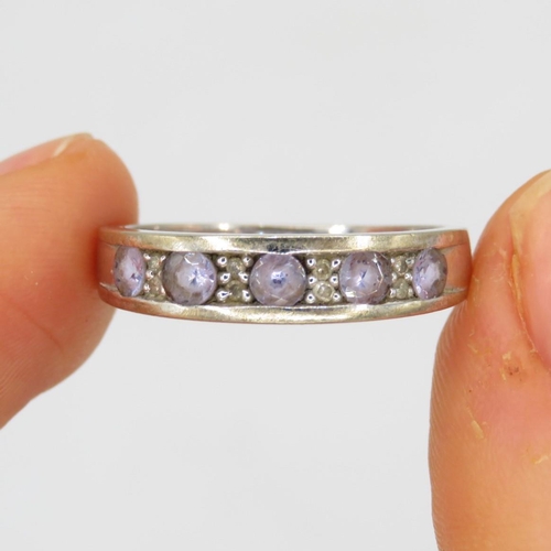 6 - 9ct white gold tanzanite five stone ring with diamond spacers (2.7g) Size P