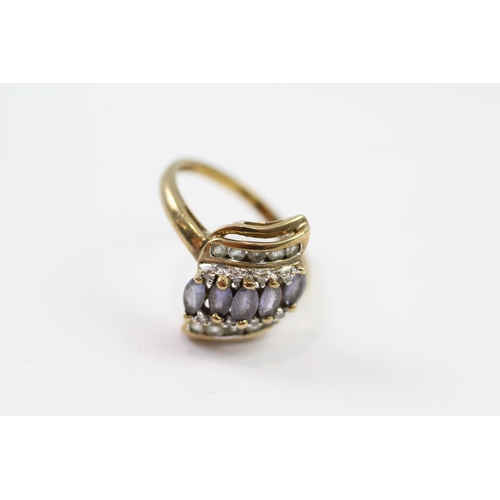 107 - 9ct gold diamond & tanzanite dress ring (2.6g) Size  N