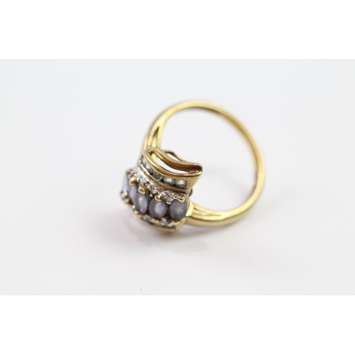 107 - 9ct gold diamond & tanzanite dress ring (2.6g) Size  N