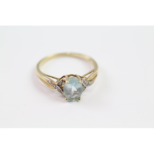 109 - 9ct gold blue topaz single stone ring with diamond set shank (1.9g) Size  P