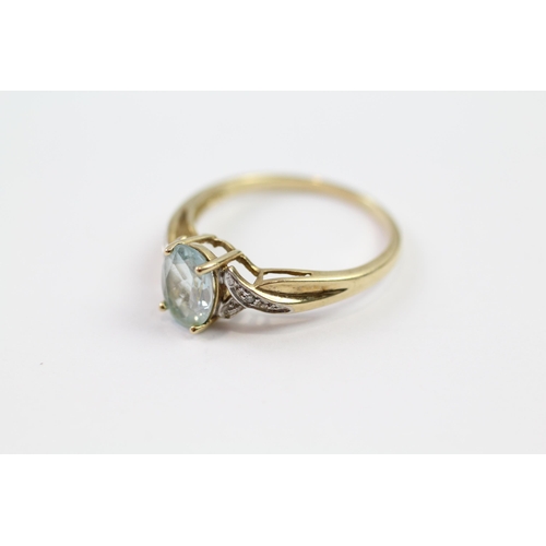 109 - 9ct gold blue topaz single stone ring with diamond set shank (1.9g) Size  P