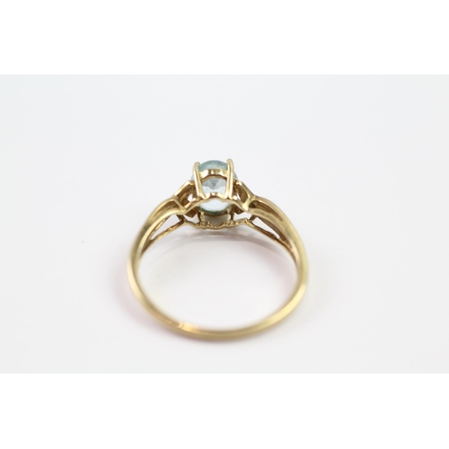 109 - 9ct gold blue topaz single stone ring with diamond set shank (1.9g) Size  P