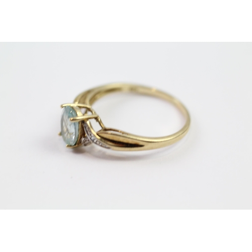 109 - 9ct gold blue topaz single stone ring with diamond set shank (1.9g) Size  P