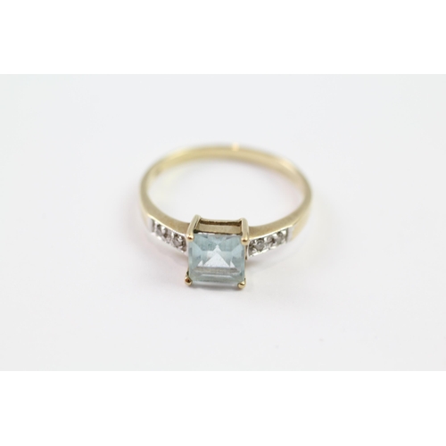 110 - 9ct gold blue topaz single stone ring with diamond set shoulders (1.8g) Size  P