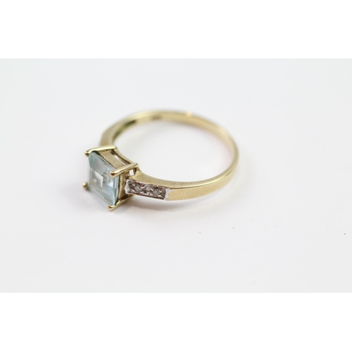 110 - 9ct gold blue topaz single stone ring with diamond set shoulders (1.8g) Size  P