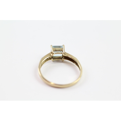 110 - 9ct gold blue topaz single stone ring with diamond set shoulders (1.8g) Size  P