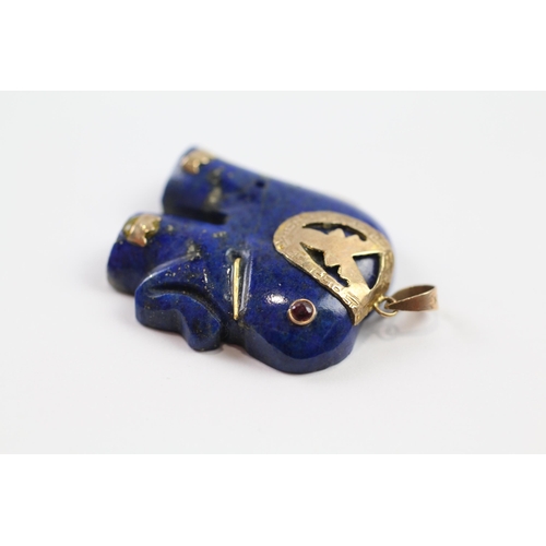 123 - 9ct gold lapis lazuli elephant pendant with ruby eyes (7.8g)