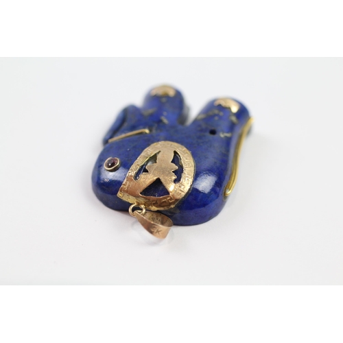 123 - 9ct gold lapis lazuli elephant pendant with ruby eyes (7.8g)