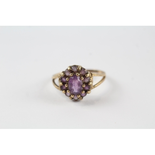 131 - 9ct gold amethyst vintage cluster ring (2g).  Ring has been cut off Size  M