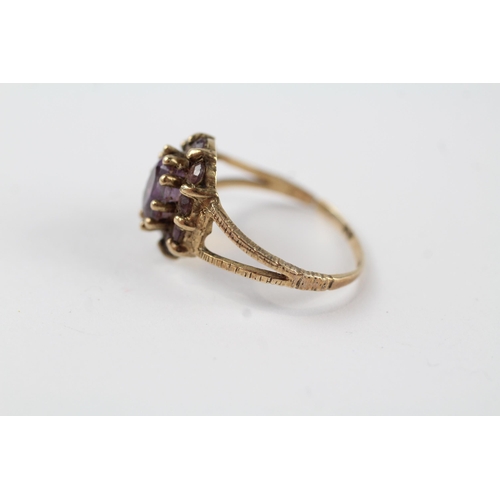 131 - 9ct gold amethyst vintage cluster ring (2g).  Ring has been cut off Size  M