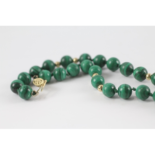 141 - 14ct gold Malachite bead necklace (66.8g)