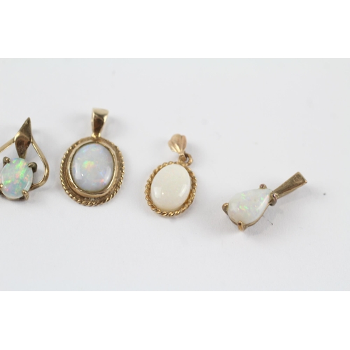 159 - 5 x 9ct gold white opal pendants (2.8g)