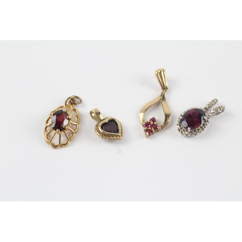 160 - 4 x 9ct gold gemstone pendants inc. diamond, garnet & ruby (3.6g)