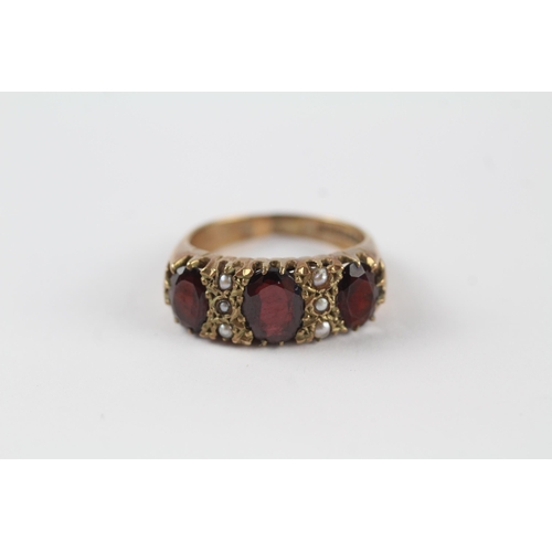 163 - 9ct gold garnet & seed pearl vintage ring (5.4g). Ring has been cut off Size  P