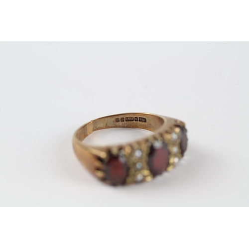 163 - 9ct gold garnet & seed pearl vintage ring (5.4g). Ring has been cut off Size  P