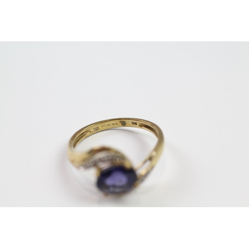 184 - 9ct gold diamond & iolite twist ring (2.8g) Size  Q 1/2